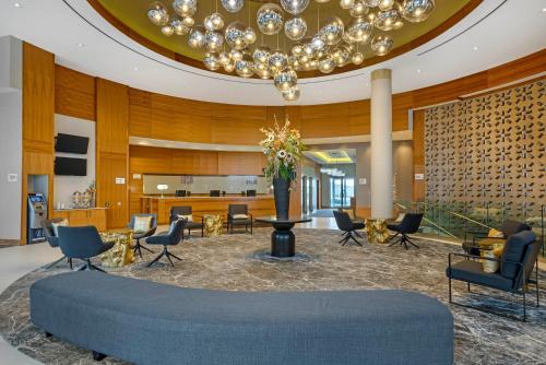 a lobby with a large blue ottoman in a room at Radisson Hotel & Conference Centre Calgary Airport in Calgary