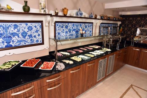 a buffet line with many different types of food at Neorion Hotel - Special Class in Istanbul