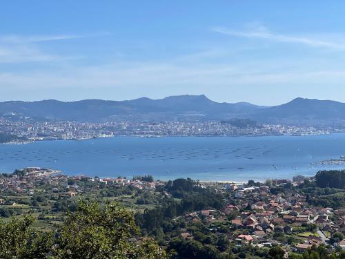 a view of a city and a body of water at Albergue O Beque in Moaña