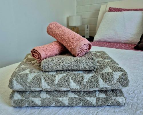 a couple of towels sitting on top of a bed at Brownlow Beach Shack in Kingscote