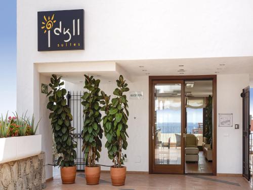 a lobby with potted plants in front of a building at Idyll Suites - Adults Only in Playa del Cura