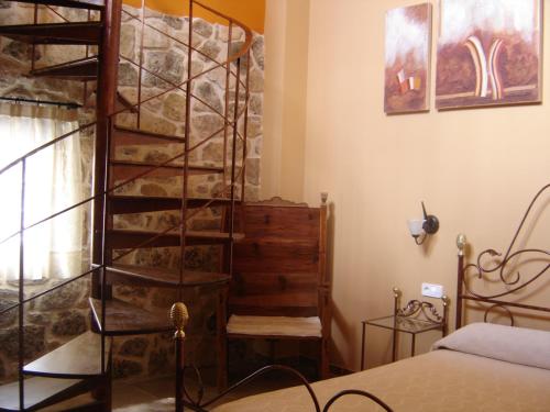 Ένα ή περισσότερα κρεβάτια σε δωμάτιο στο Hostal Casa Laure y Mª Jose
