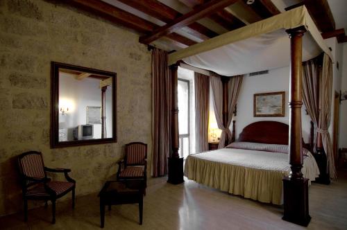 Postel nebo postele na pokoji v ubytování Señorio de Olmillos
