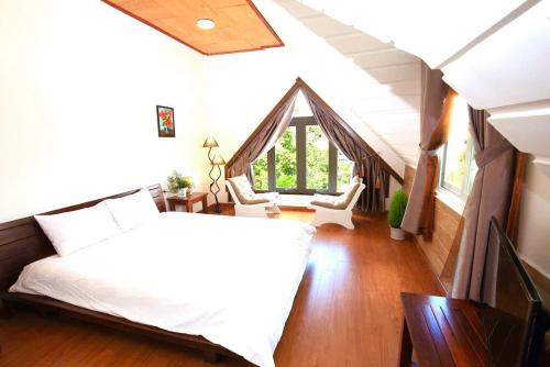 Llit o llits en una habitació de Dan Chi Hotel