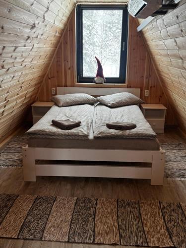 a bedroom with a bed in a room with a window at 3A-Chalet-Liban in Liban