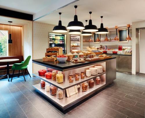 a bakery with food on display in a store at citizenM Amsterdam Airport Schiphol in Schiphol