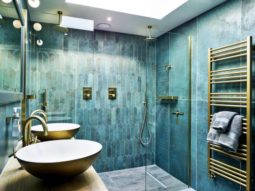 a bathroom with a sink and a shower at Finest Retreats - Sea Gables in Exmouth