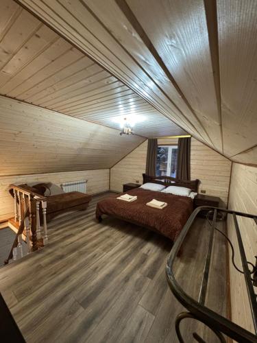 a bedroom with two beds in a room at Лісова тиша Дворівневий Люкс in Synevyrsʼka Polyana