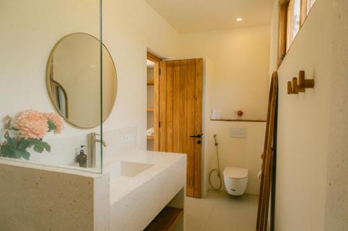 a bathroom with a sink and a mirror at Promo - Private 1BR villa for couples in Kuta Lombok