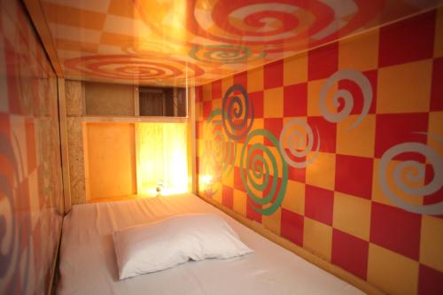Cama o camas de una habitación en Base Inn Komagome Tokyo