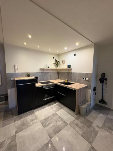 a large kitchen with a sink and a counter at Entspannt wohlfühlen! in Gießen