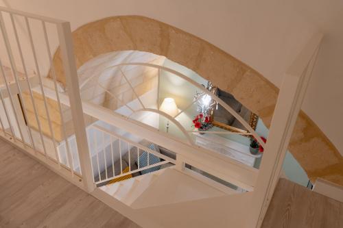 an overhead view of a spiral staircase with a stair case at SASSO BIANCO in Matera