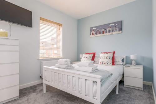 a bedroom with a white bed and a window at Avalon - Walking Distance to Poole Quay and Town in Poole