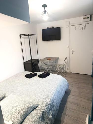 Llit o llits en una habitació de Studio des Capucins 2