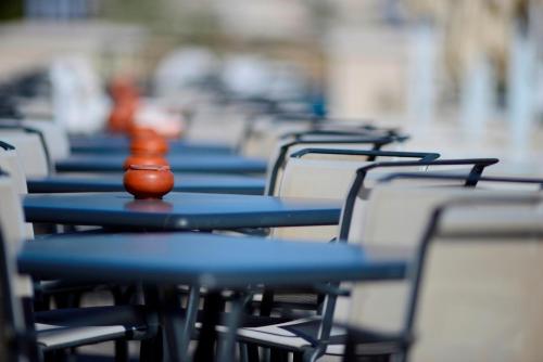 a row of tables and chairs with blue seats at Stella Di Mare Beach Hotel & Spa in Sharm El Sheikh