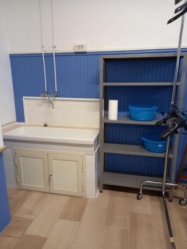 a bathroom with a sink and a camera on a tripod at I Love Host 24 in Montefiascone