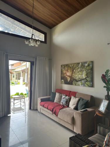 a living room with a couch and a window at Casa da Serra Bananeiras in Bananeiras