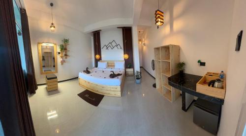 a bedroom with a bed and a sink in a room at Ella Forest Eco View in Ella