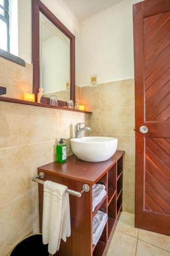 a bathroom with a sink and a mirror at Muthu Mara River Lodge in Masai Mara