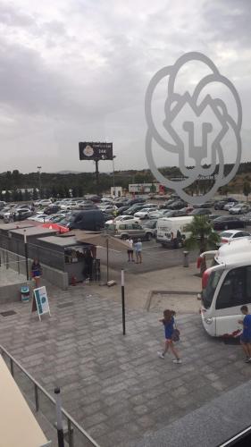 a parking lot with a bunch of parked cars at Complejo Leo 24H in Monesterio