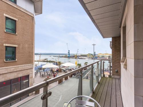 a balcony with a view of a marina at Baywatch - Private Balcony Overlooking Poole Quay in Poole