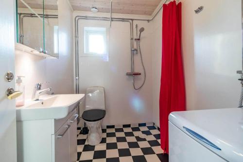 a bathroom with a sink and a toilet and a shower at KRO803-Haeradsbaeck-Ellagoelshult-4 in Häradsbäck