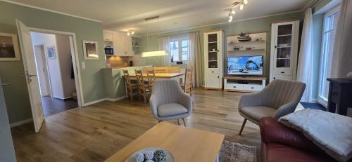 a living room with a couch and a table at Perlmuschel in Borkum