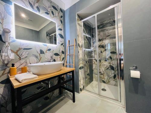 a bathroom with a sink and a shower at La Dimora del Generale in Pizzo