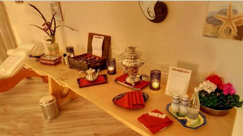 a table with candles and other items on it at Hotel Boton D'Or & Wellness a La Thuile in La Thuile