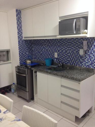 A cozinha ou cozinha compacta de Nannai Residence - Flat familiar
