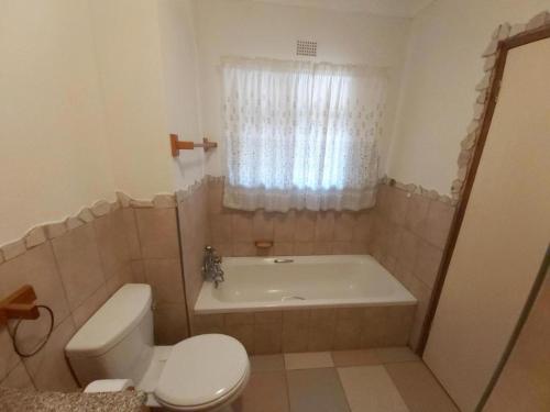 a bathroom with a tub and a toilet and a sink at Crayfish Inn no5 in Ramsgate