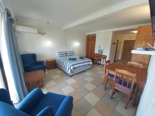 a living room with a bed and a dining room at Crayfish Inn no5 in Ramsgate