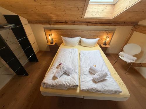 a bedroom with a bed with two socks on it at Ferienwohnung Haus Bader in Garmisch-Partenkirchen