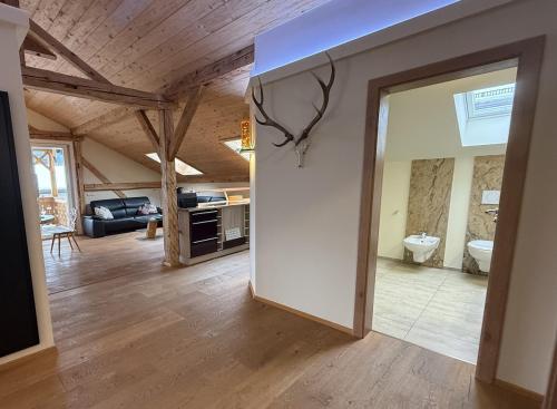 a living room with a door open to a living room at Ferienwohnung Haus Bader in Garmisch-Partenkirchen