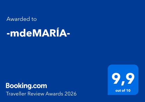 a blue sign with the words upgraded to indiamaria at -mdeMARÍA- in Suances