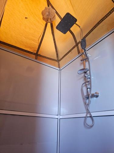 a shower head hanging from a ceiling at Luxury Desert Queen Camp in Merzouga