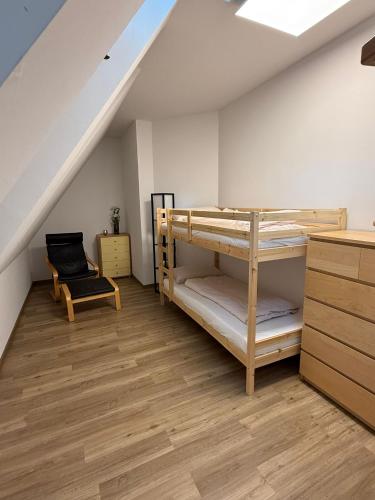 a bedroom with bunk beds in a attic at Hof Volkmann in Nordkirchen