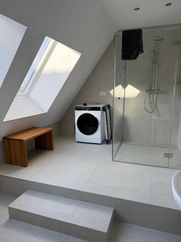 a bathroom with a shower and a microwave at Hof Volkmann in Nordkirchen