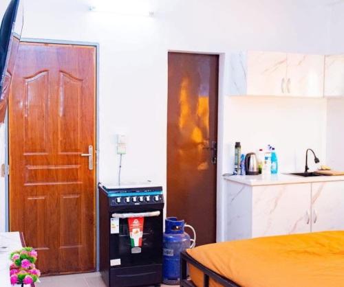 Kuchyň nebo kuchyňský kout v ubytování Appartement Ouaga 2000