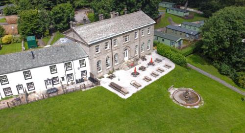 an aerial view of a large house on a lawn at Waterfoot Park in Pooley Bridge