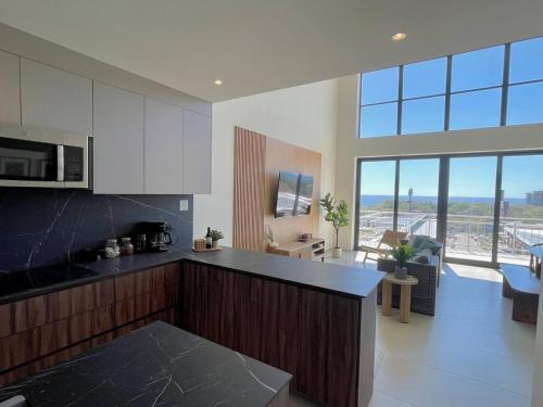 Kuhinja ili čajna kuhinja u objektu Oceanview Loft Mare