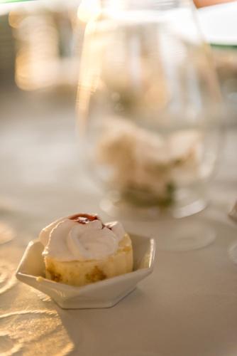 a cupcake on a plate on a table at Tamaca Beach Resort in Santa Marta