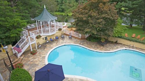 an overhead view of a swimming pool with an umbrella at Airlie in Warrenton