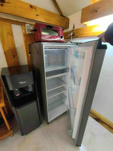 an open refrigerator with a red box on top of it at Lolo Dads Cabin in Sagada