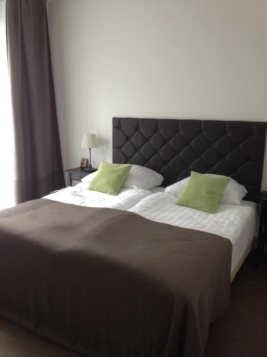Кровать или кровати в номере Apartment am Zwingerteich