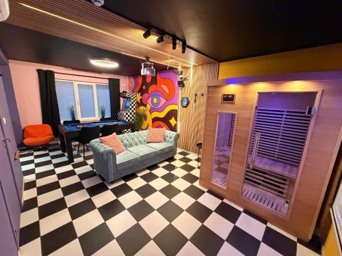 a living room with a couch and a piano at Capsule illusion - Switch 2 - Mons Centre in Mons
