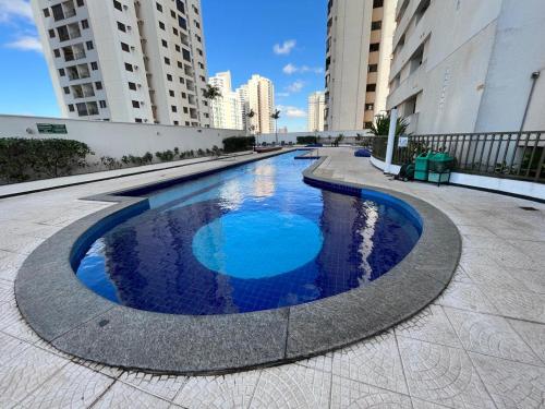 a large swimming pool in the middle of a building at Santorini Piscina Hidro Academia Salt Hospital Premium Jaime Câmara Mercatto Store Moreira Marista Blue Fit Perdomo Vaca Brava Goiânia Shopping Areião Marista Ze Abílio Serrinha Campo do Goiás Hailé Pinheiro in Goiânia