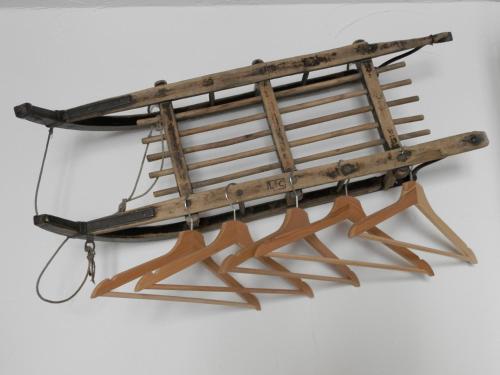 a wooden boat hanging on a wall at B&B Le Ciaf in Temù