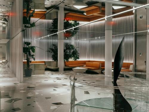 a lobby with a glass table and a couch at Hotel Josef in Prague