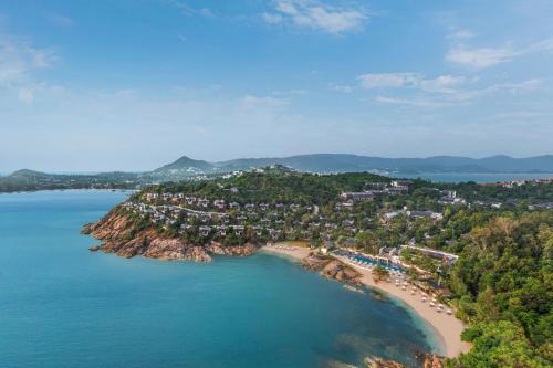 an aerial view of a resort on a beach at The Ritz-Carlton, Koh Samui in Choeng Mon Beach